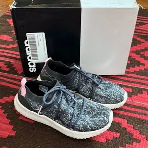 Gently worn gray Adidas slip on sneakers